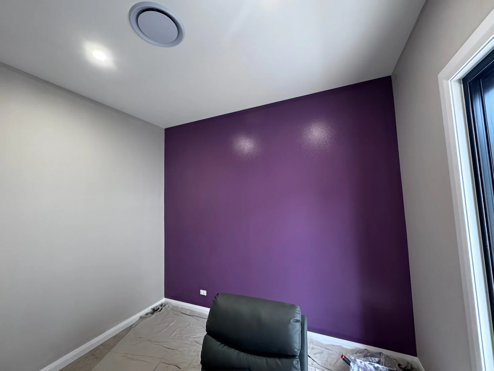 Purple feature wall with light grey surrounding walls